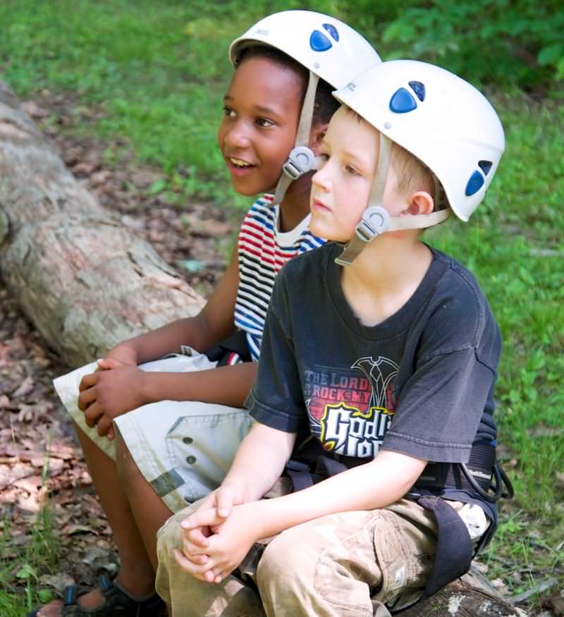 Photo of Two Boys at Day Camp Wearing Helmets