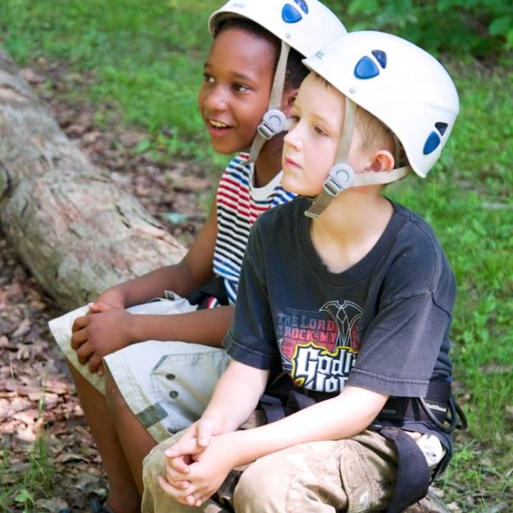 Photo of Two Boys at Day Camp Wearing Helmets